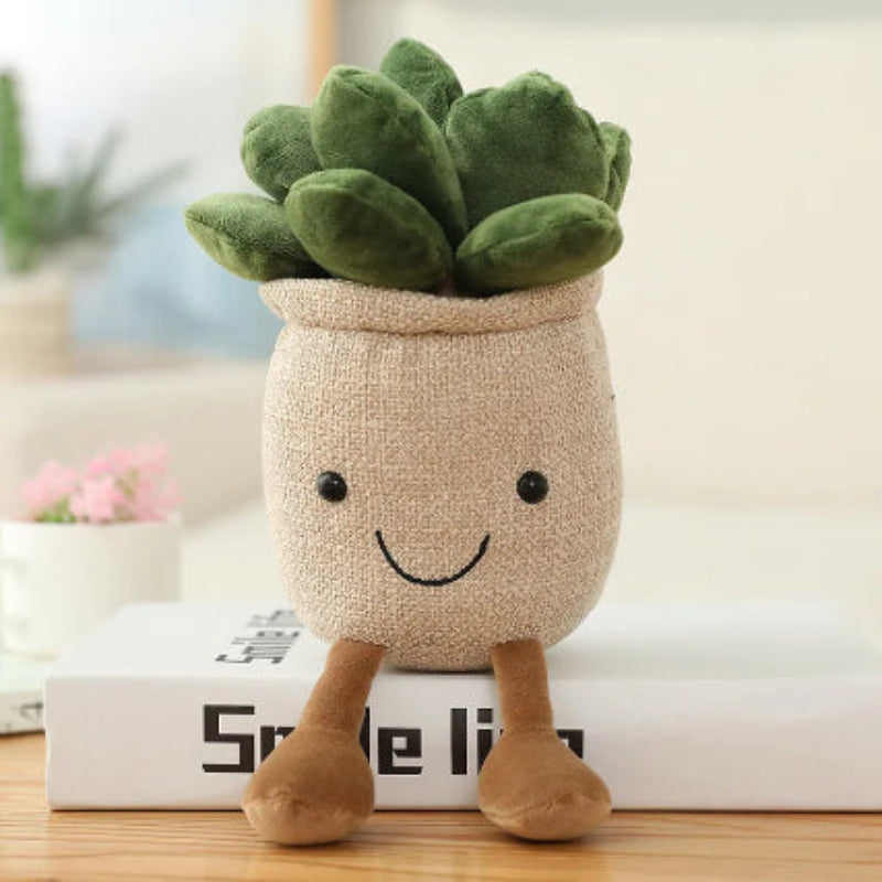 Plush toy shaped like a potted plant with a smiling face on a wooden surface.