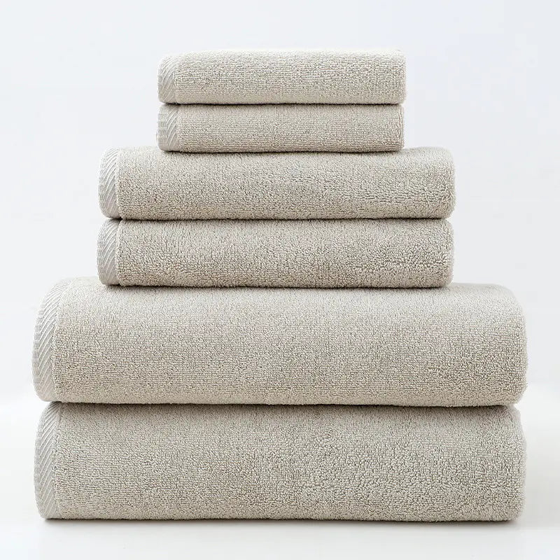 Stack of beige towels on a white background