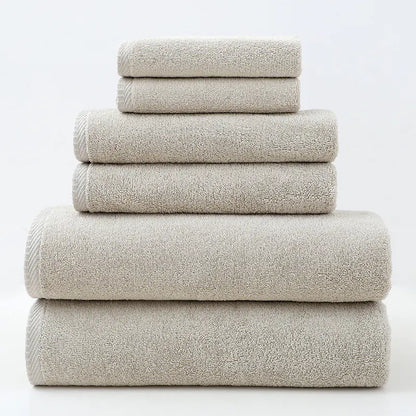 Stack of beige towels on a white background